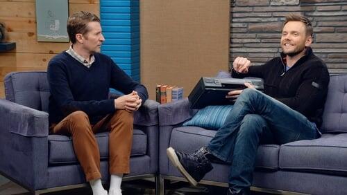 Joel McHale Wears a Navy Zip-up and High Tops